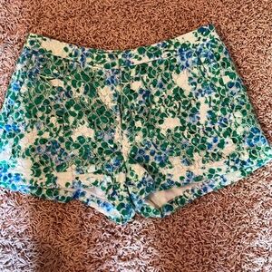 Size 2, textured green and blue floral print shorts. Front and back pockets.